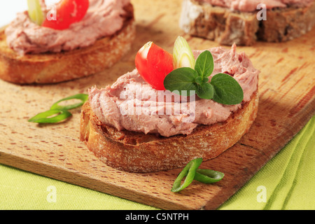 Slices of toasted bread with delicious liver pate Stock Photo