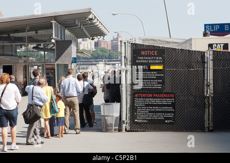 Ferry passengers enter New York Waterway Pier 11 / Wall Street ferry terminal during the afternoon rush hour in New York City. Stock Photo