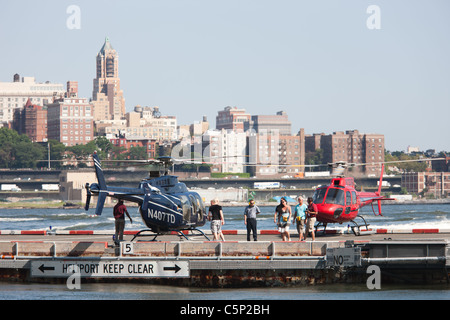 Passengers board helicopters at the Downtown Manhattan Heliport in New York City. Stock Photo