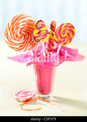 Different kinds of lollipops in a glass Stock Photo