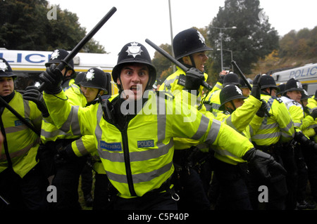 Police using batons and pepper spray clash with Smash EDO protestors along Lewes Road Brighton Stock Photo