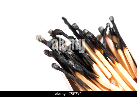 burned matches in a box, isolated on white background Stock Photo