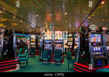 Casino slot machines and gambling electronic games. Aboard a cruise ship for recreation and winning. Stock Photo