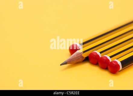 Pencils arranged so that one is the 'odd one out' Stock Photo