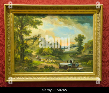 Banksy painting of traditional landscape with abandoned car, The 'Banksy vs. Bristol Museum' exhibition Stock Photo