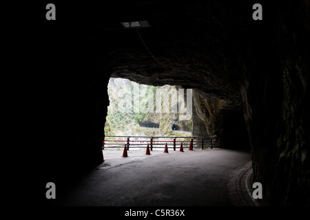 Cliffside tunnel's galleries, road under rock overhang along marble canyons, Tunnel of Nine Turns, Taroko National Park, Hualien, Taiwan Stock Photo