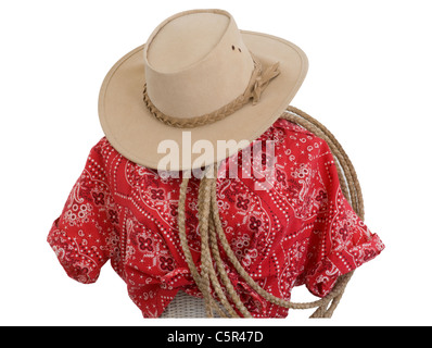 Western gear. Cowgirl blouse,  cowboy hat, and  rope. Blouse is red  bandana print and rope is handmade leather lariat  isolated on a mannequin. Stock Photo