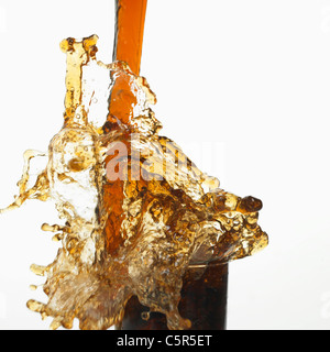 Coke pouring down to a glass Stock Photo