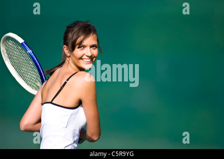 A tennis player smiles at camera. Stock Photo