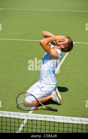 This tennis player should have trained harder to win the game. Stock Photo
