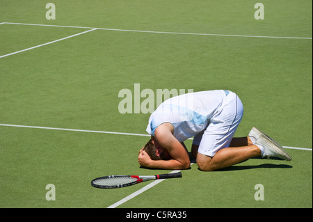 This tennis player injured on court. Stock Photo