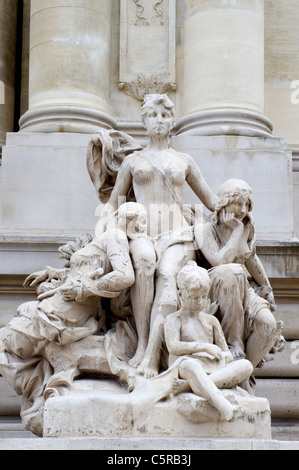 Paris - The statue Seine and its tributaries - facade of Grand Palais by Desire-Maurice Ferrary (1852–1904). Stock Photo