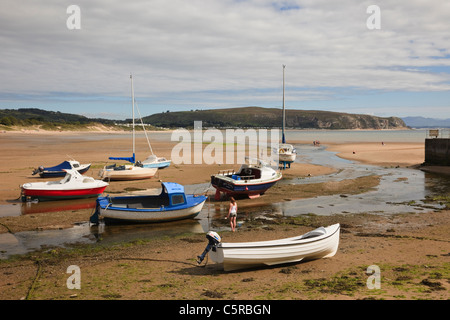 Beached boats moored in the harbour at the mouth of Afon Soch River estuary at low tide. Abersoch Lleyn Peninsula North Wales UK Stock Photo
