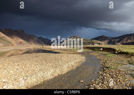 Storm Clouds over the Barmur Rhyolite Mountains and the River Jokulgilskvisl at Landmannalaugar in the Fjallabak Area of Iceland Stock Photo