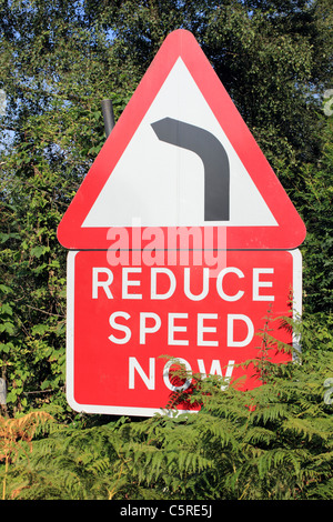 Reduce Speed Now road sign Hindhead Surrey England UK Stock Photo