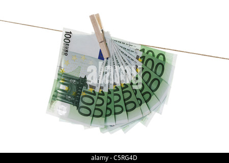 100 Euro bank notes hanging on clothesline Stock Photo