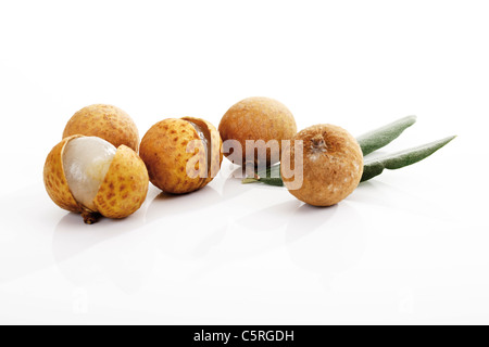 Longan fruits and leaves Stock Photo