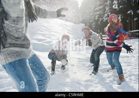 Austria, Salzburg Country, Flachau, Young people snow fighting in snow Stock Photo