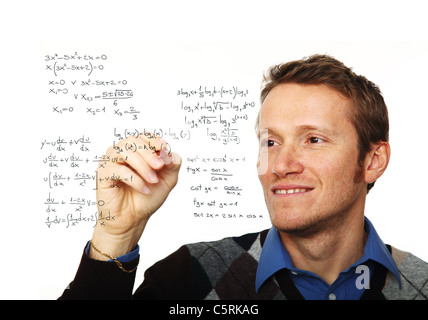 portrait of young man writing on glass board isolated on white Stock Photo