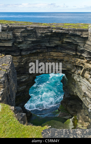 dh  ROUSAY ORKNEY Rousay north coast seacliffs sea arch and geo scotland Stock Photo