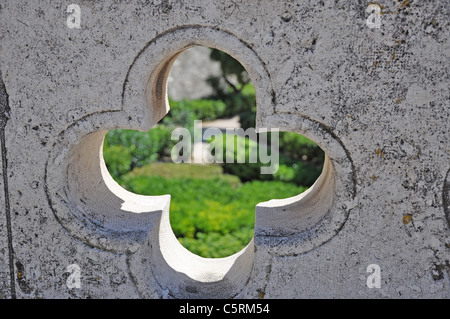 wall with a view on a green garden Stock Photo