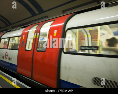 Moving Northern line tube leaving platform Stock Photo