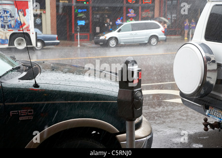 heavy rain on car hood downtown broadway Nashville Tennessee USA Stock Photo