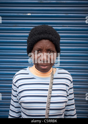 Street portrait of an Ecuadorian woman with African roots taken in Quito, Ecuador. Stock Photo