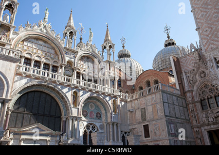 Plaza, piazza, square of Saint Marks Basilica showing architecture of the facade and buildings. Stock Photo