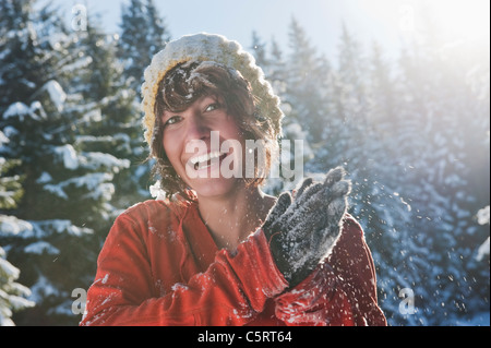 Austria, Salzburg Country, Flachau, Young woman having fun in snow Stock Photo