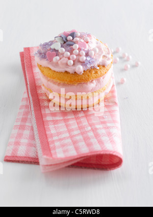 Close up of strawberry whoopie pie on napkin against white background Stock Photo