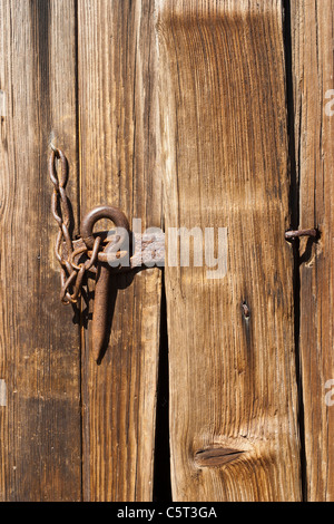Old lock on a door to a barn Stock Photo