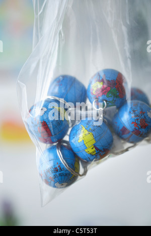 Europe, Germany, Close up of earth globes in plastic bag Stock Photo