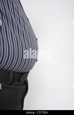 Close up of mature man with big belly against white background Stock Photo