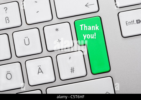 Illustration of keyboard having green key with thank you sign, close up Stock Photo