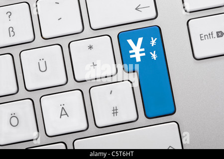 Illustration of keyboard having blue key with yen symbol, close up Stock Photo