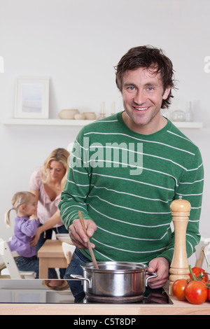 father cooking munich bavaria germany daughter mother alamy background