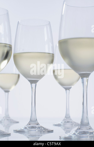 White wine glasses filled with white wine Stock Photo