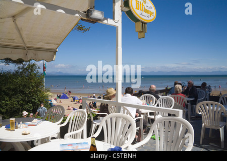 Llanbedrog Gwynedd North Wales UK July Holiday makers lunching in beach side cafe of this Welsh seaside resort on Llyn Peninsula Stock Photo