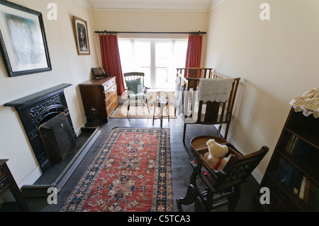 Old fashioned baby's nursery in a Victorian home at the Ulster Folk Park Museum Stock Photo