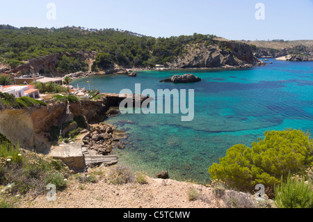 Ibiza, Balearics, Spain - Cala Xarraca, rocky inlet and bay with beach, rocks and woodlands Stock Photo