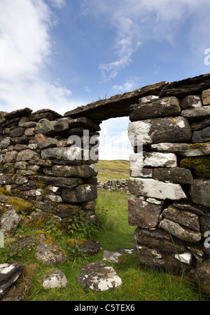 Stone doorway of ruined old croft building, Boreraig, Isle of Skye, Scotland, UK Stock Photo