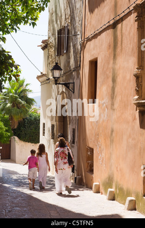 Ibiza, Balearics, Spain - family walking through Eivissa city, in the Dalt Vila or old town historic area Stock Photo