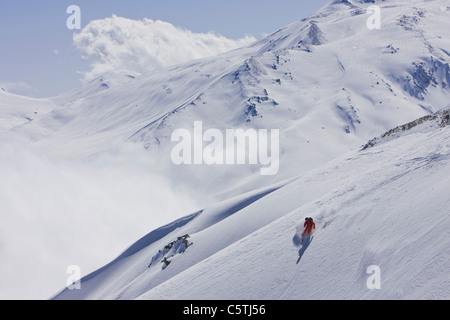 India, Kashmir, Gulmarg, Man skiing downhill Stock Photo