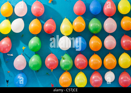 Germany, Bavaria, Munich, Multi coloured balloons and dart at oktoberfest Stock Photo