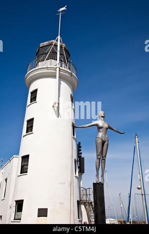 The Lighthouse and diving belle sculpture, Scarborough Harbour, North Yorkshire Stock Photo