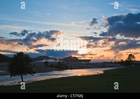 USA, Wyoming, Yellowstone National Park, Firehole River near steaming geysers at sunset Stock Photo