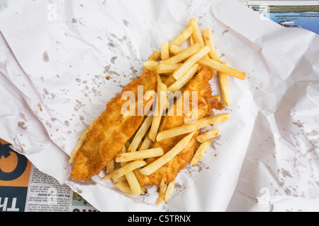 British fish and chips on paper, elevated view Stock Photo