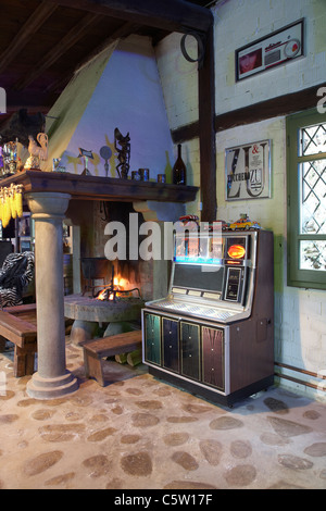 Interior of living  room  with a fireplace and a jukebox  