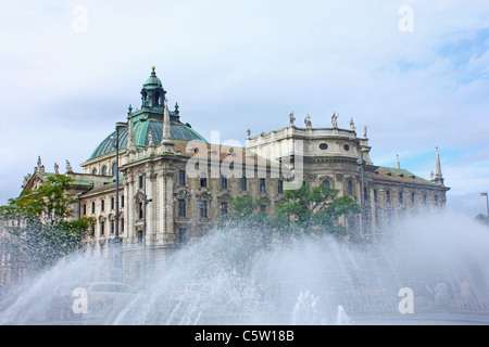 Stachus large square in central Munich with fountain and old Justizpalast, Karlsplatz Stock Photo